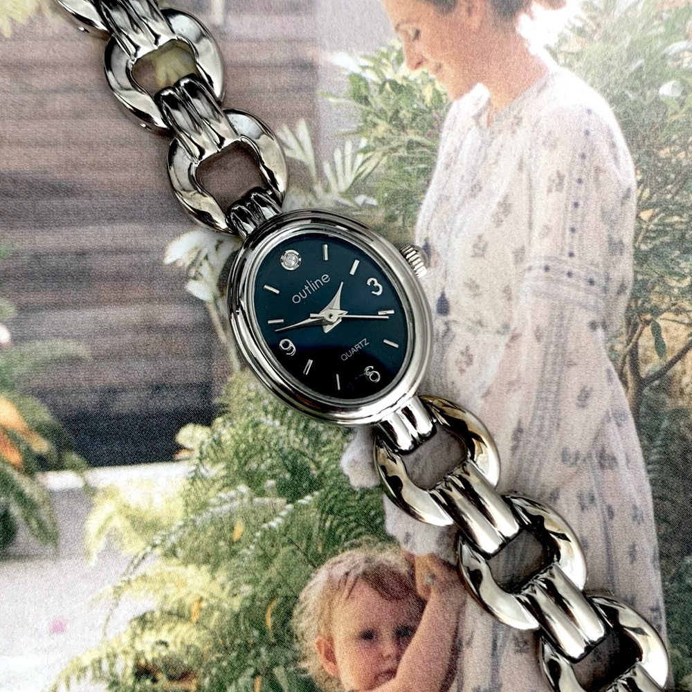 Diamond accent with Royal Blue Oval Face women’s stainless steel watch